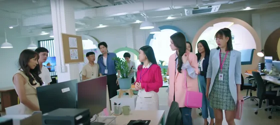 Cast members of gap, the series in an office.